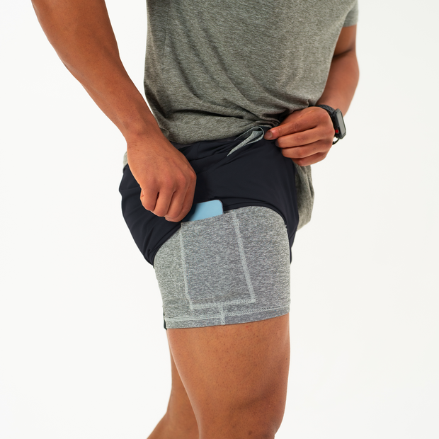 Base Short 5.5" Black on model showing the grey heather liner that has a built-in phone pocket