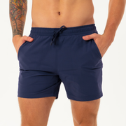 Base Short 5.5" Navy front on model with hands in pockets
