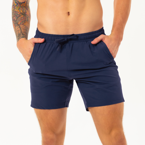 Base Short 7" Navy front on model with hands in both pockets