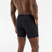 Stretch Swim 5.5" in Black back on model with hand in inseam pocket