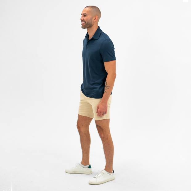 Stretch Chino Short 7" in Sand Dune on model worn with Tech Polo in Navy