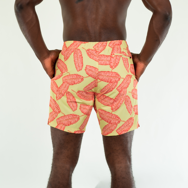 Stretch Swim 7" Banana Leaf back on model with hand in inseam pockets