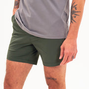 Tour Short 5.5" Dark Olive front on model with two front seam pockets