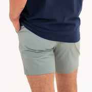 Tour Short 7" Grey back on model with back zipper pockets and logo above back right pocket