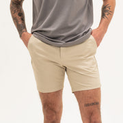 Tour Short 7" Khaki on model with zipper fly and two front seam pockets