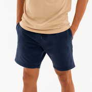 Loft Short 7" Navy front on model with hands in pockets