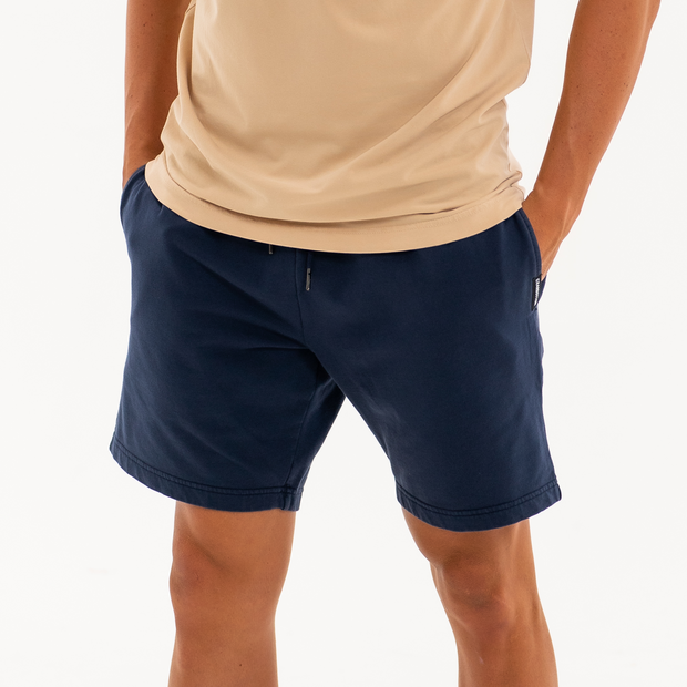 Loft Short 7" Navy front on model with hands in pockets