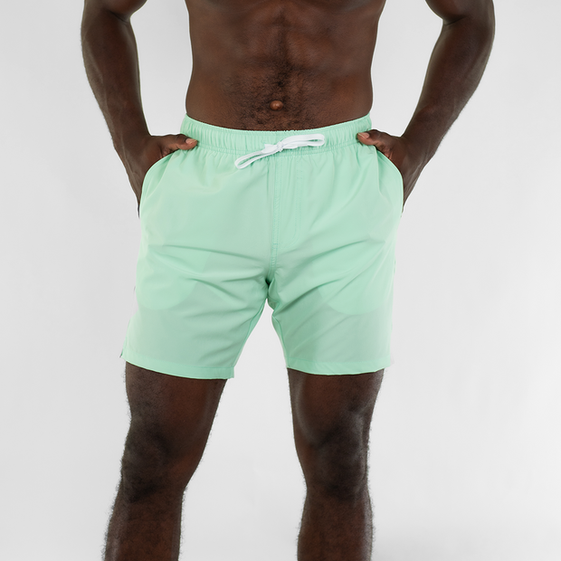 Stretch Swim 7" in Mint front on model with hands in inseam pockets