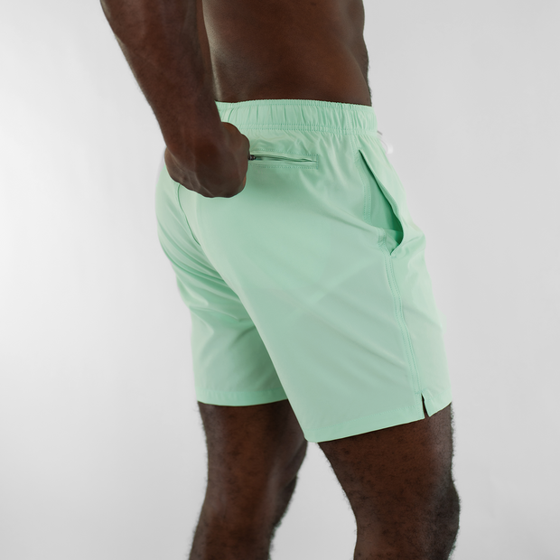 Stretch Swim 7" in Mint back on model zipping back right zippered pocket