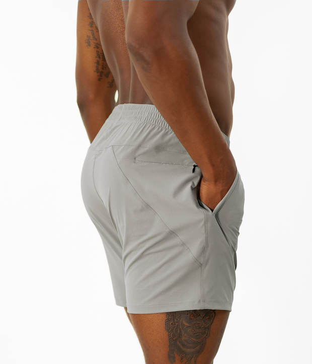 Atlas Short 5.5" Grey right side on model with hand in inseam pocket
