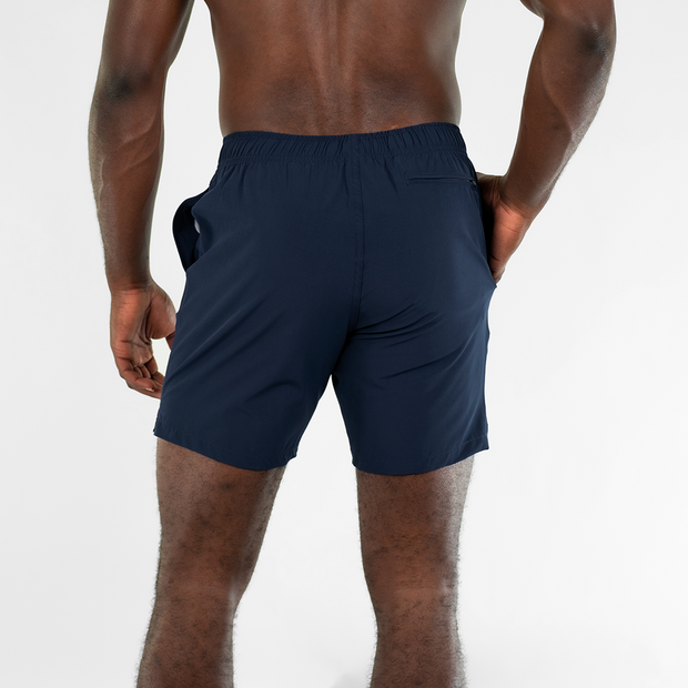 Stretch Swim 7" in Navy back on model with hand in inseam pocket