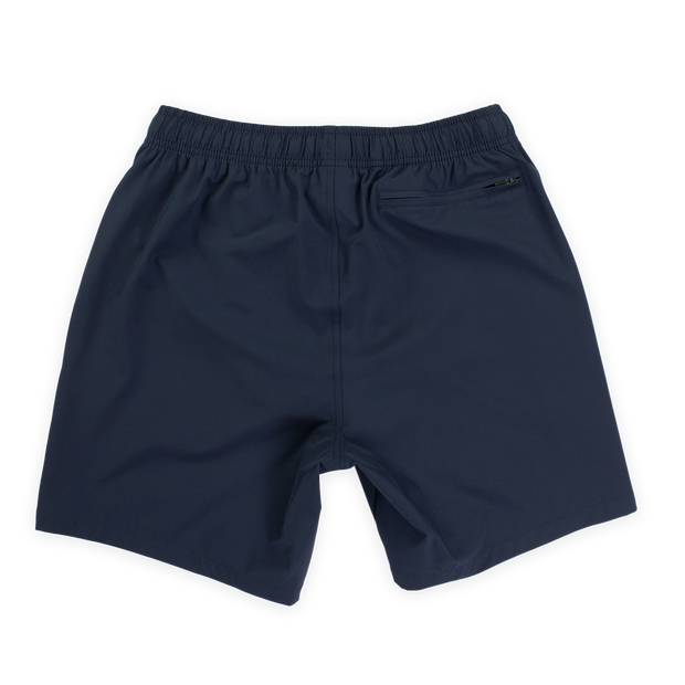Stretch Swim 7" in solid Navy blue back with elastic waistband and back right zippered pocket