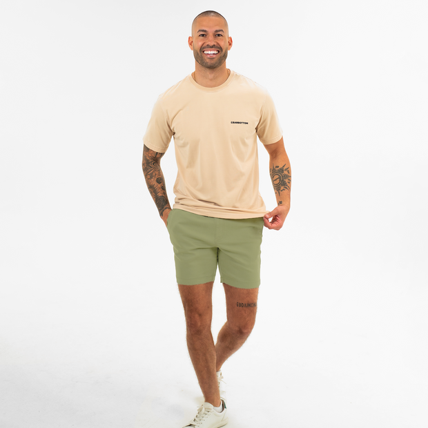 Alto Short 7" inseam in Olive front on model worn with Natural Dye Logo Tee in Sand