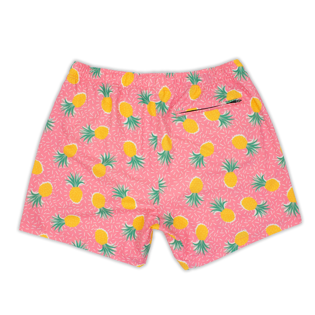 Stretch Swim 5.5" Pineapple Punch back with pink background and yellow pineapples and tiny white lines with an elastic waistband and back right zippered pocket