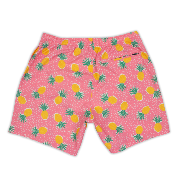 Stretch Swim 7" Pineapple Punch back with pink background and yellow pineapples and tiny white lines with an elastic waistband and back right zippered pocket