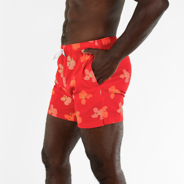 Stretch Swim 5.5" Hibiscus side on model with hand in inseam pocket