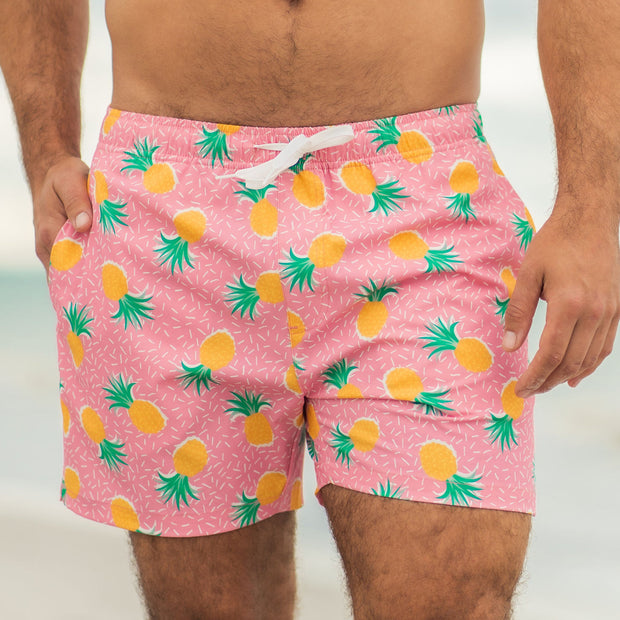 Stretch Swim 5.5" Pineapple Punch on model with hand in inseam pocket