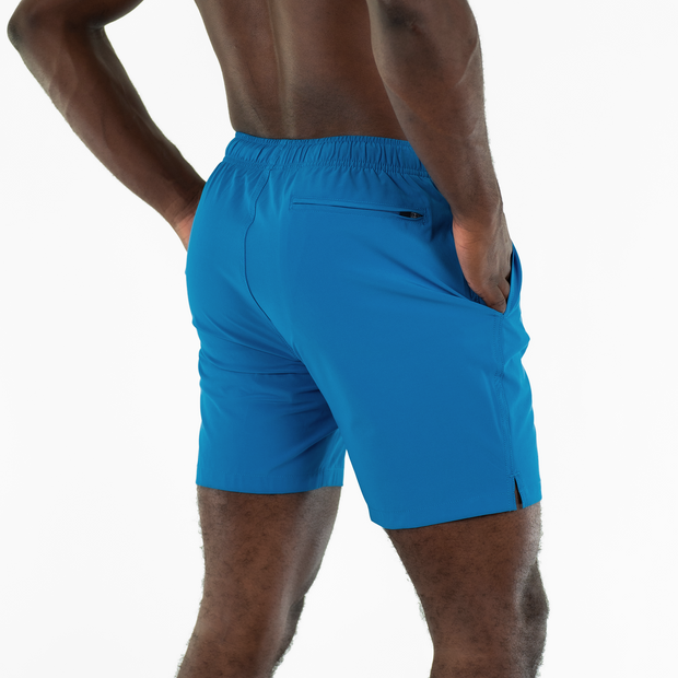 Stretch Swim 7" Blue back on model with hands in inseam pockets