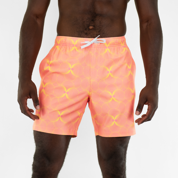 Stretch Swim 7" Groovy front on model with an elastic waistband, two inseam pockets, and a white drawstring