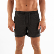 Volley Short 5.5" Black front on model with elastic waistband and black and white drawstring