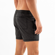 Volley Short 5.5" Black back on model with elastic waistband and back right patch pocket