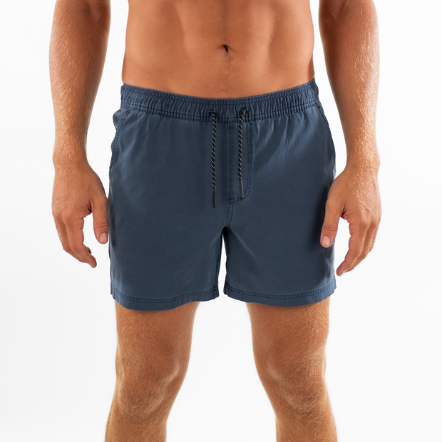 Volley Short 5.5" Navy front on model  with elastic waistband and black and white drawstring