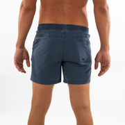 Volley Short 5.5" Navy back on model with elastic waistband and back right patch pocket