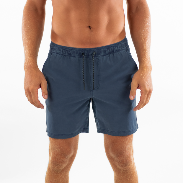 Volley Short 7" Navy Front on model with elastic waistband and black and white drawstring