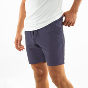 Volley Short 7" Purple side on model with elastic waistband and black and white drawstring